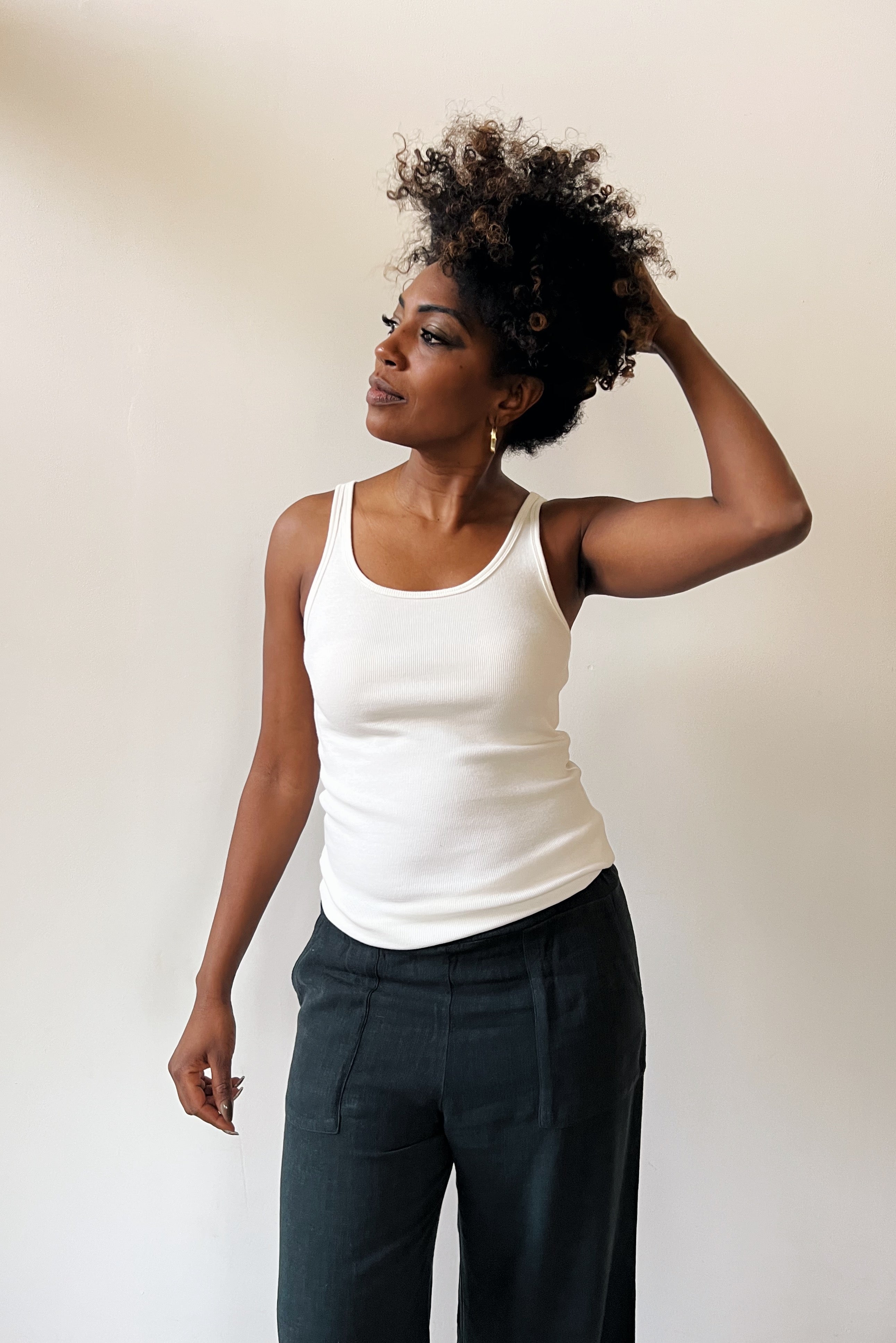 Tanktop in soft rib with open neck and fine shoulder straps.