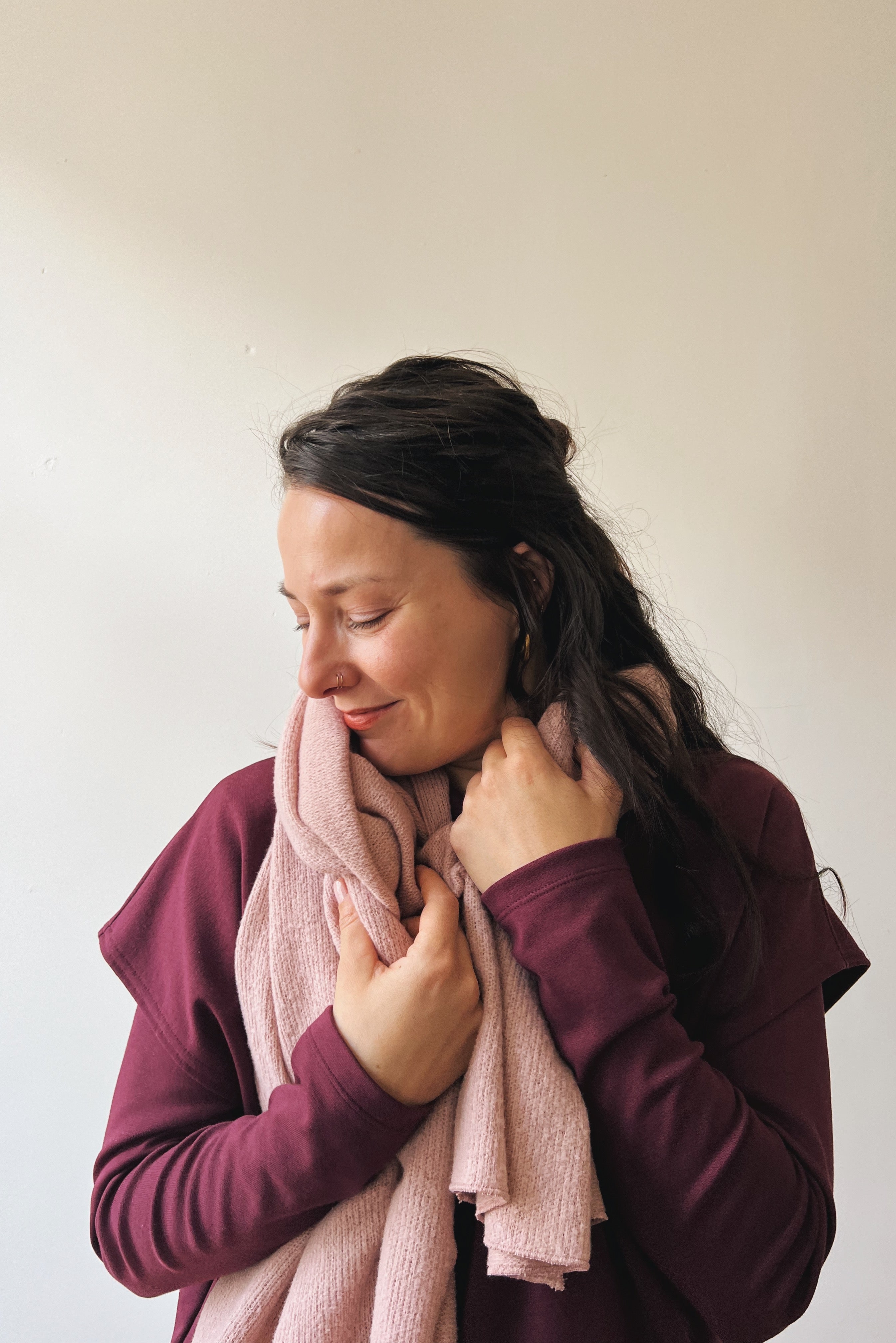Woman wearing a soft pink scarf