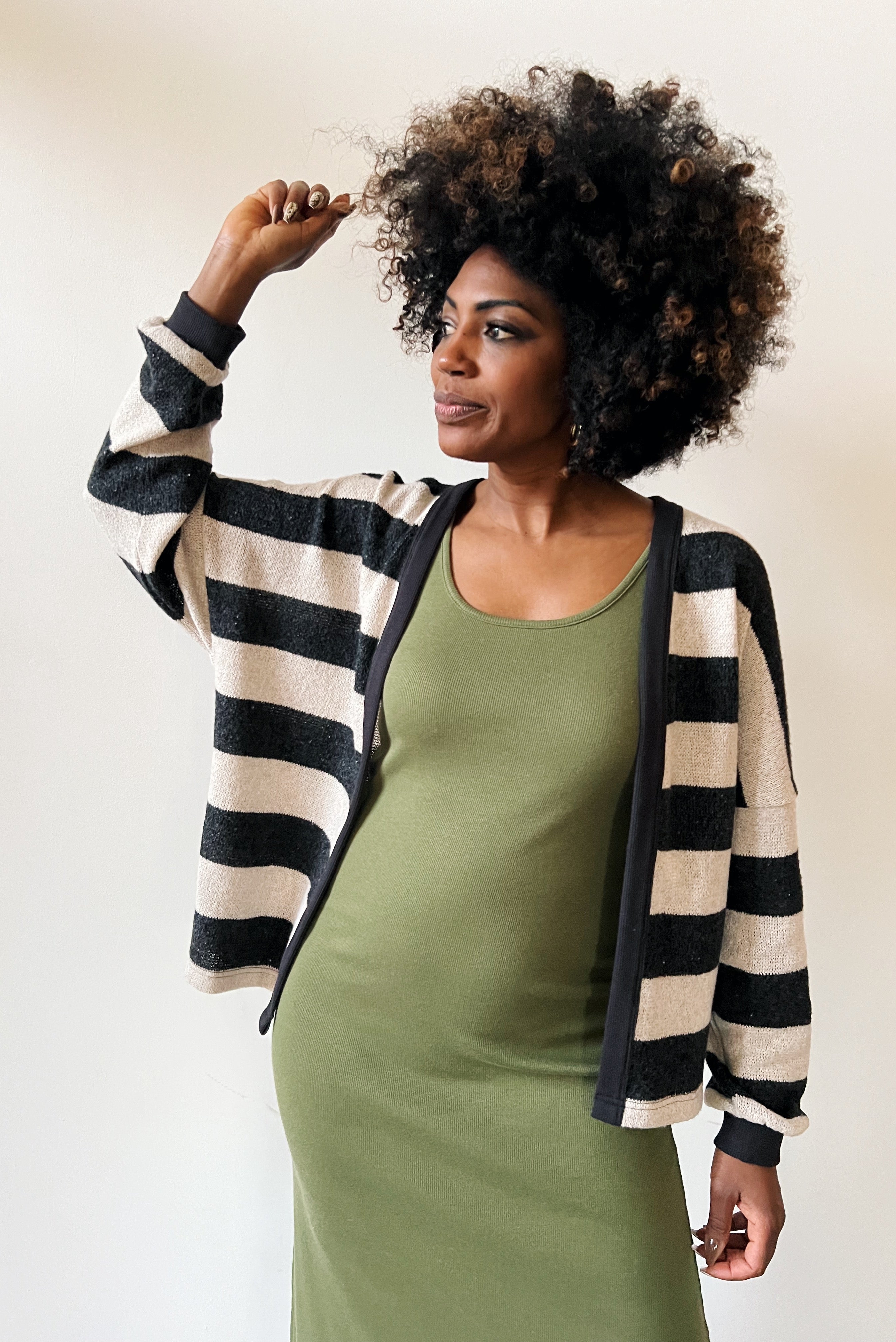 Long singlet dress with an open neckline and one side slit.