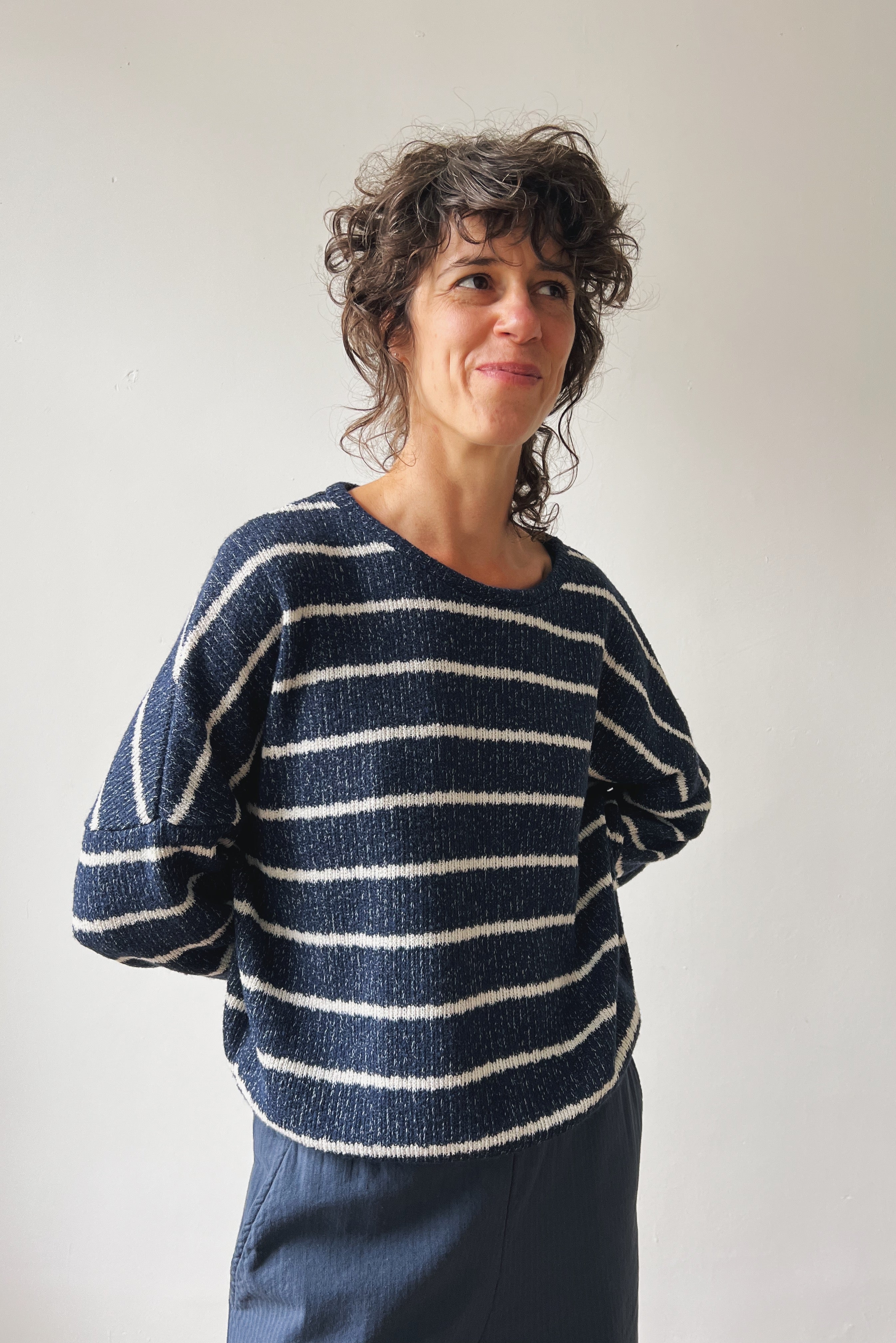 Woman wearing a blue-white striped sweater