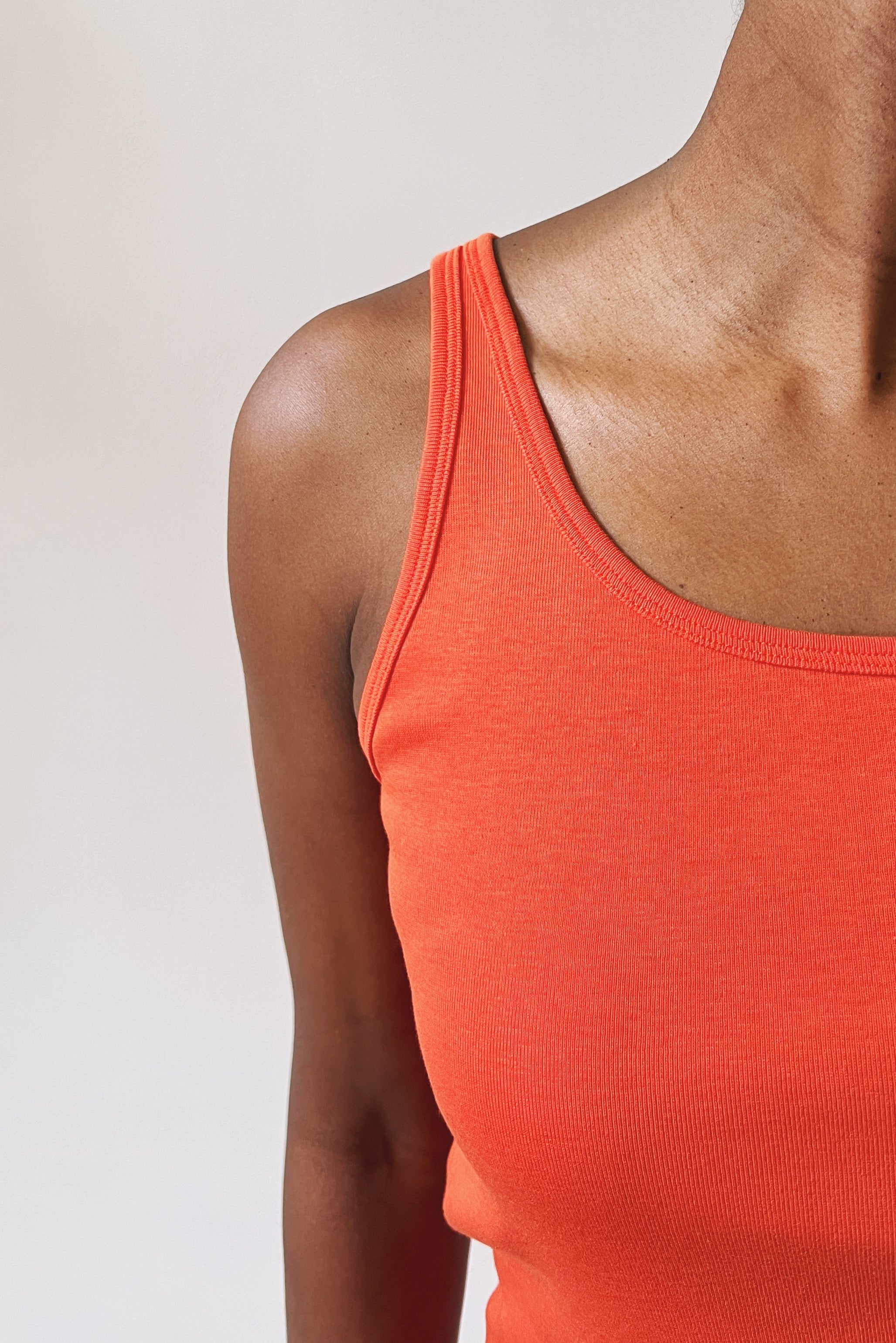 Tanktop in soft rib with open neck and fine shoulder straps.