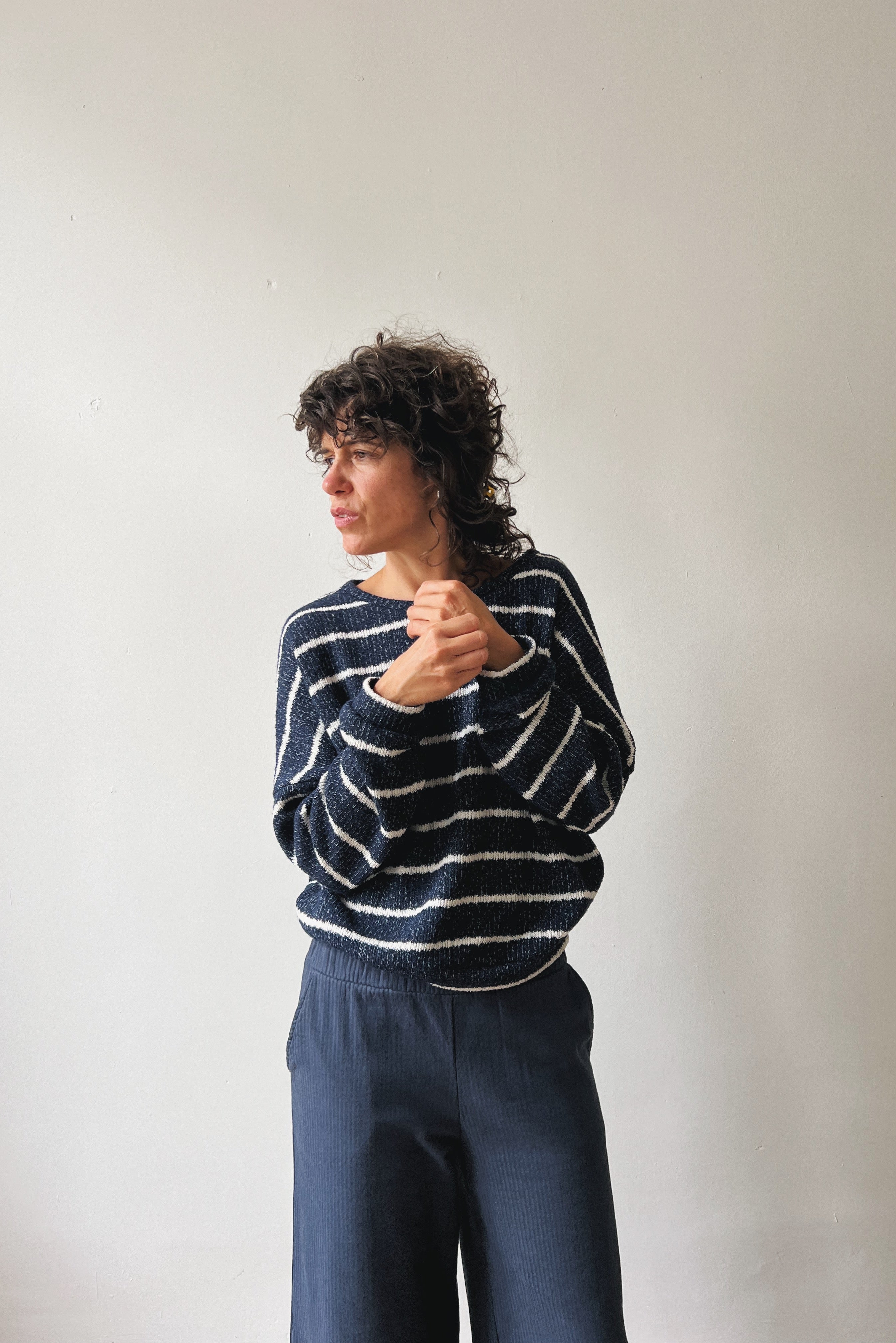 Woman wearing a blue-white striped sweater