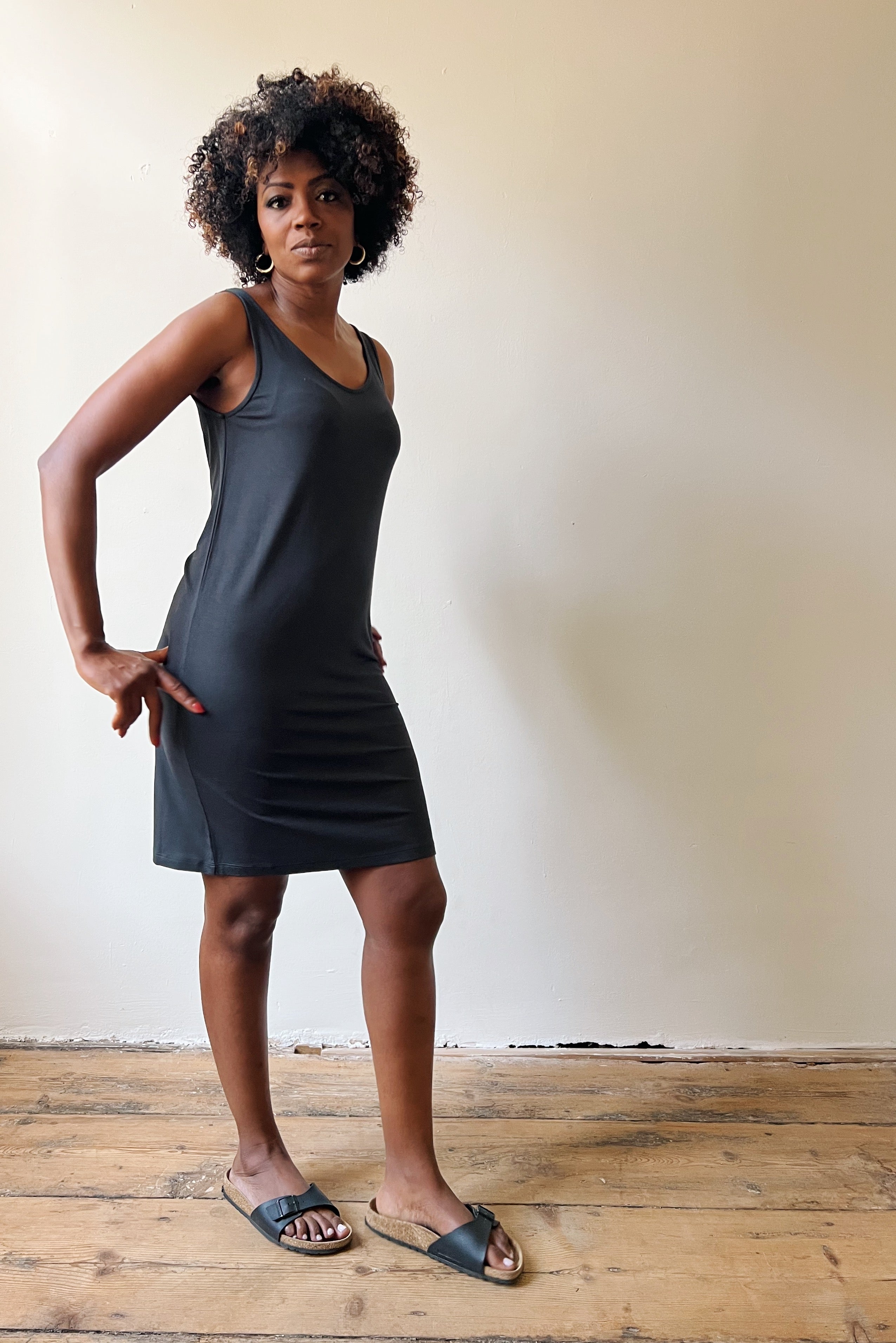 Straight singlet dress in soft silky viscose with an open neck and back.