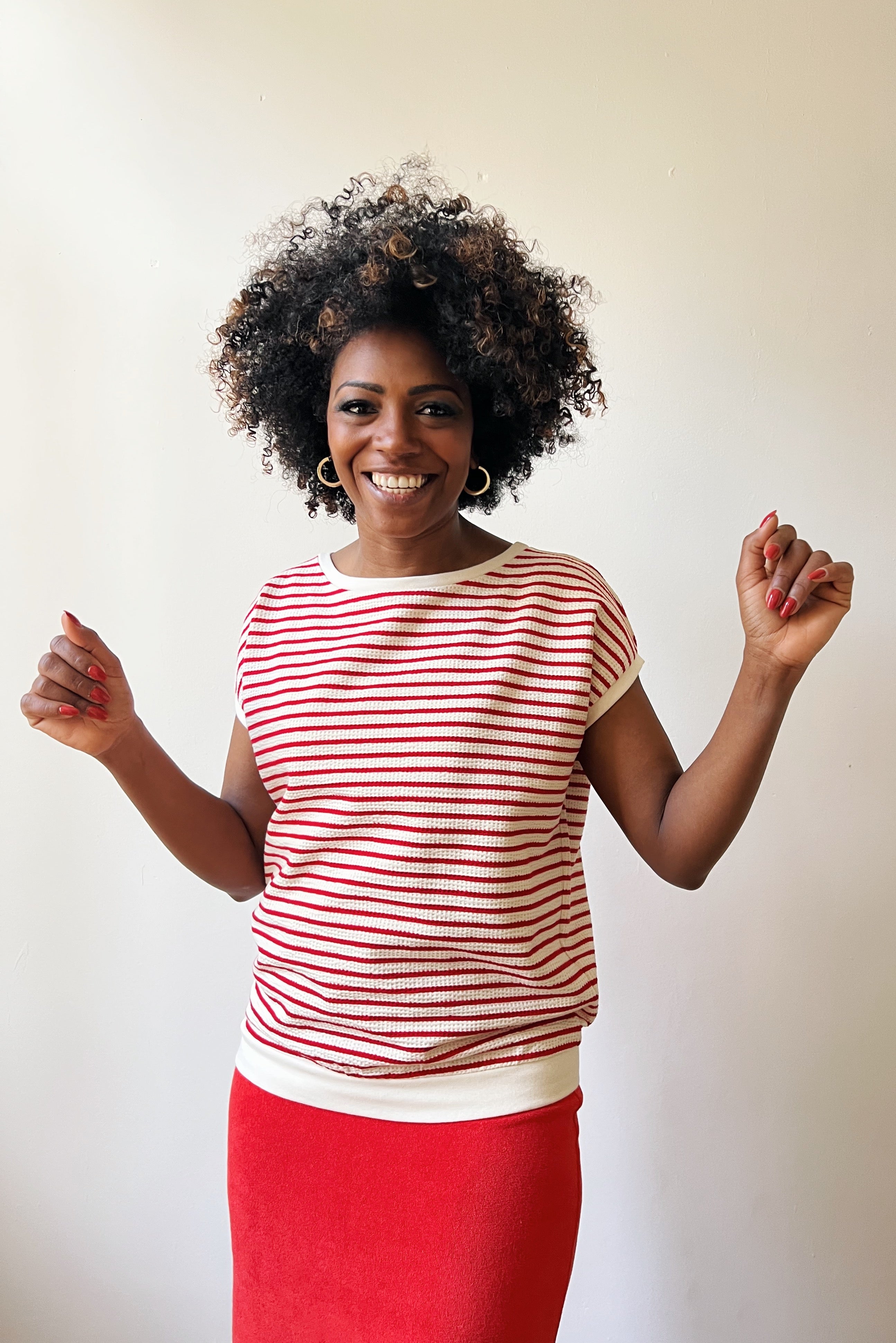 Loose top with round neck in refined knitted jersey with stripes. Finished of with a soft rib.